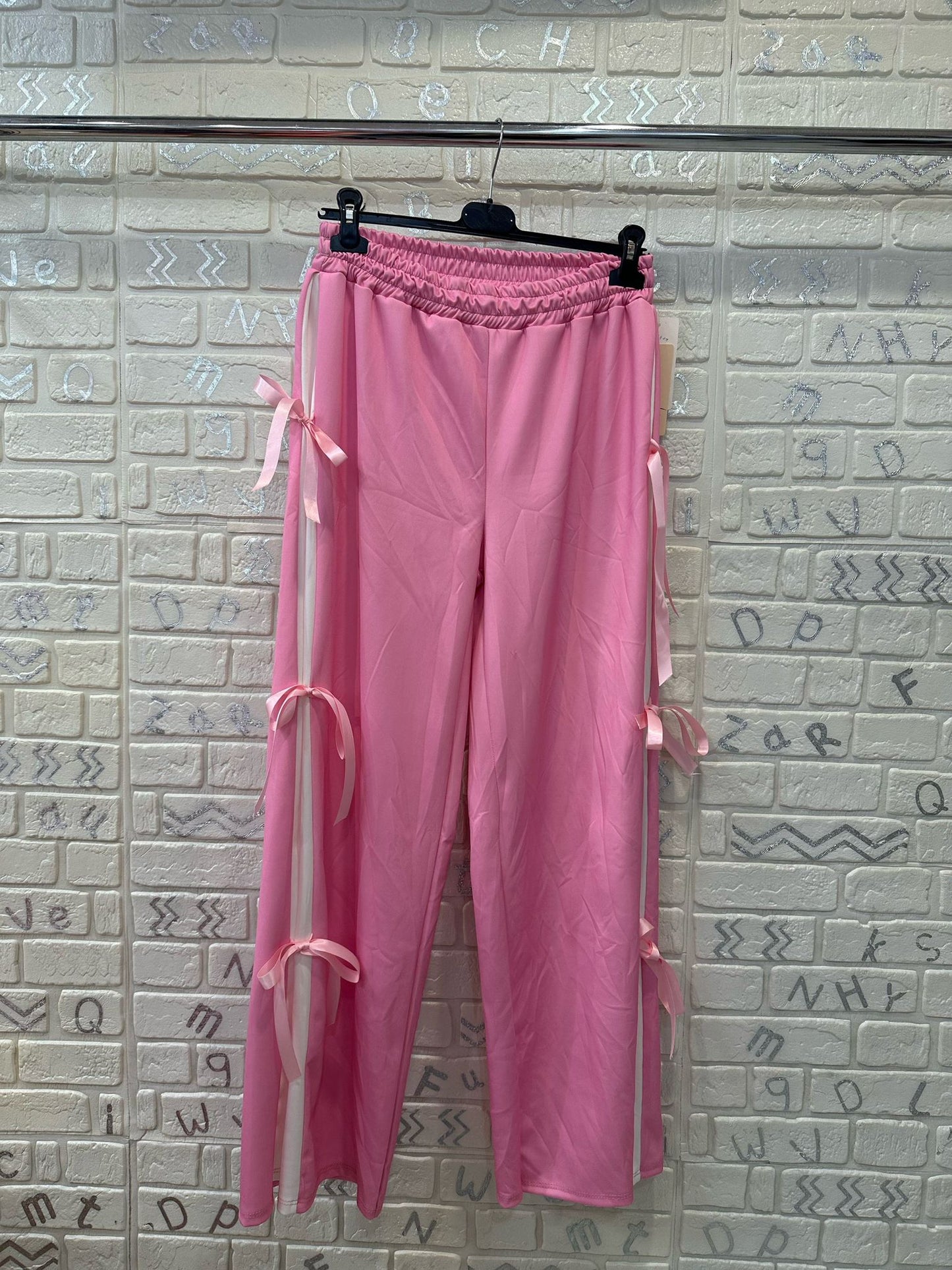 PANTALONI CON FIOCCHI